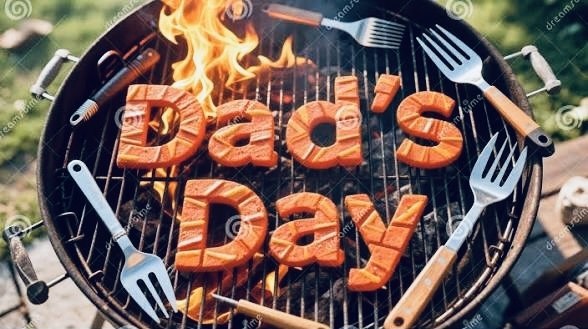 Barbecue grill with sausages arranged to spell 'Dad's Day' and grilling tools around the grate, with flames visible.