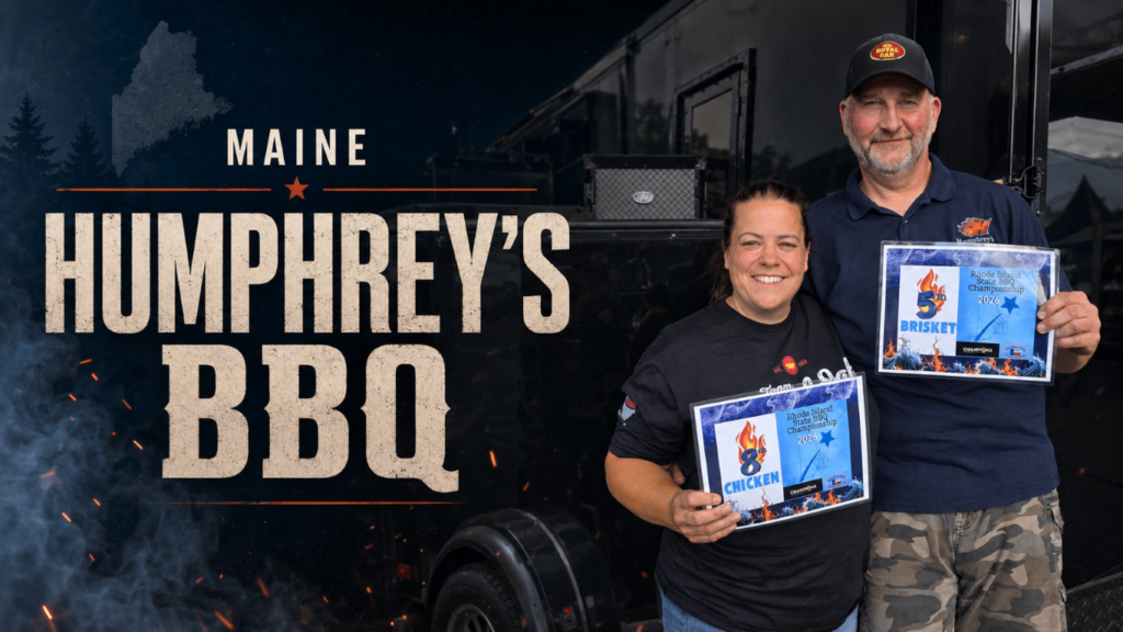 Jack_2026_03 Two smiling award winners stand side by side in front of a Maine Humphrey's BBQ sign, each holding a framed barbecue championship certificate.