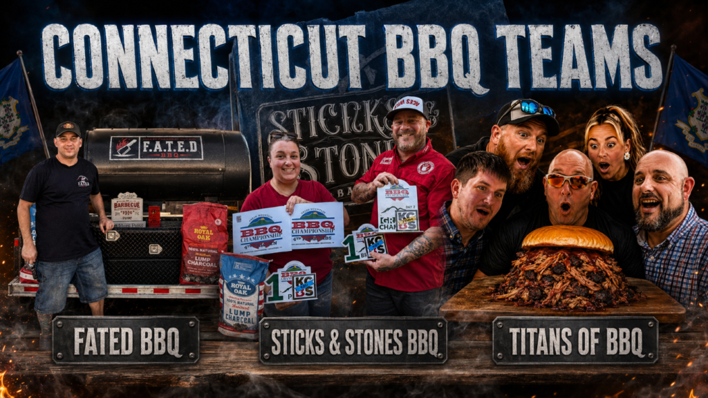 Jack_2026_04 Group of Connecticut BBQ teams posing with awards and bags in front of a smoker, banners read FATED BBQ, Sticks & Stones BBQ, Titans of BBQ, and a giant pulled-pork sandwich on a wooden board behind them уваж.